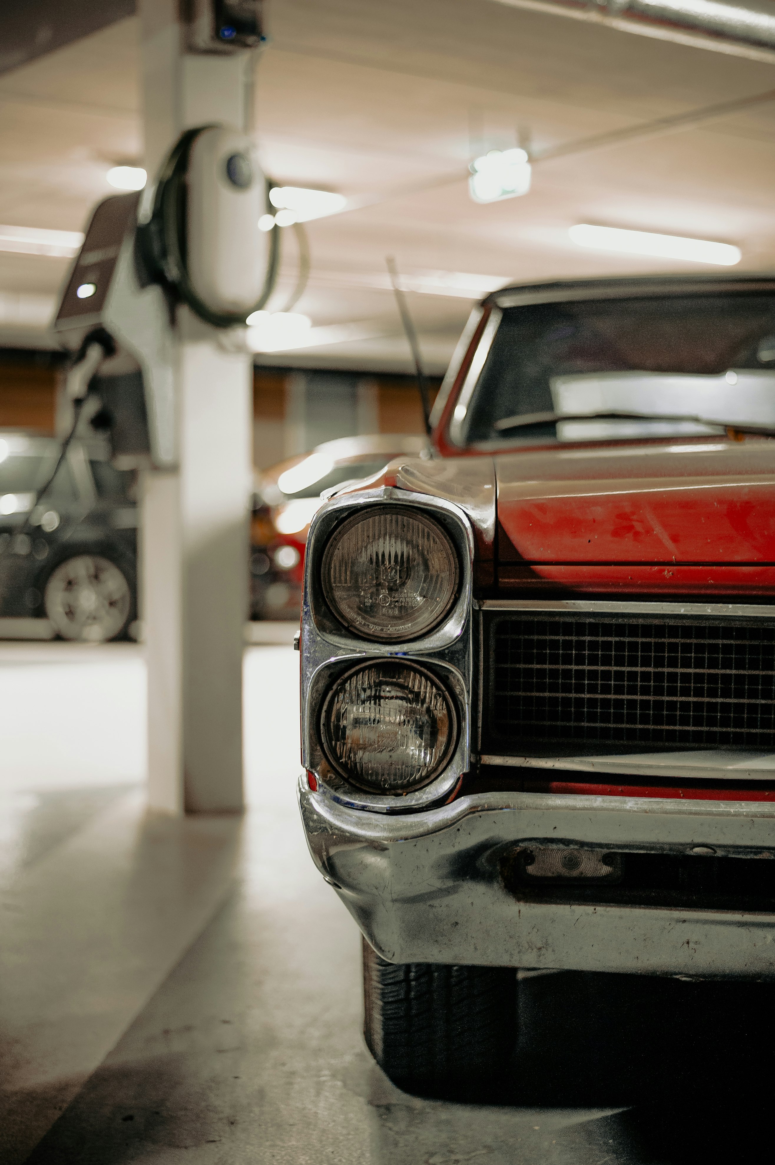 red and silver car in a room